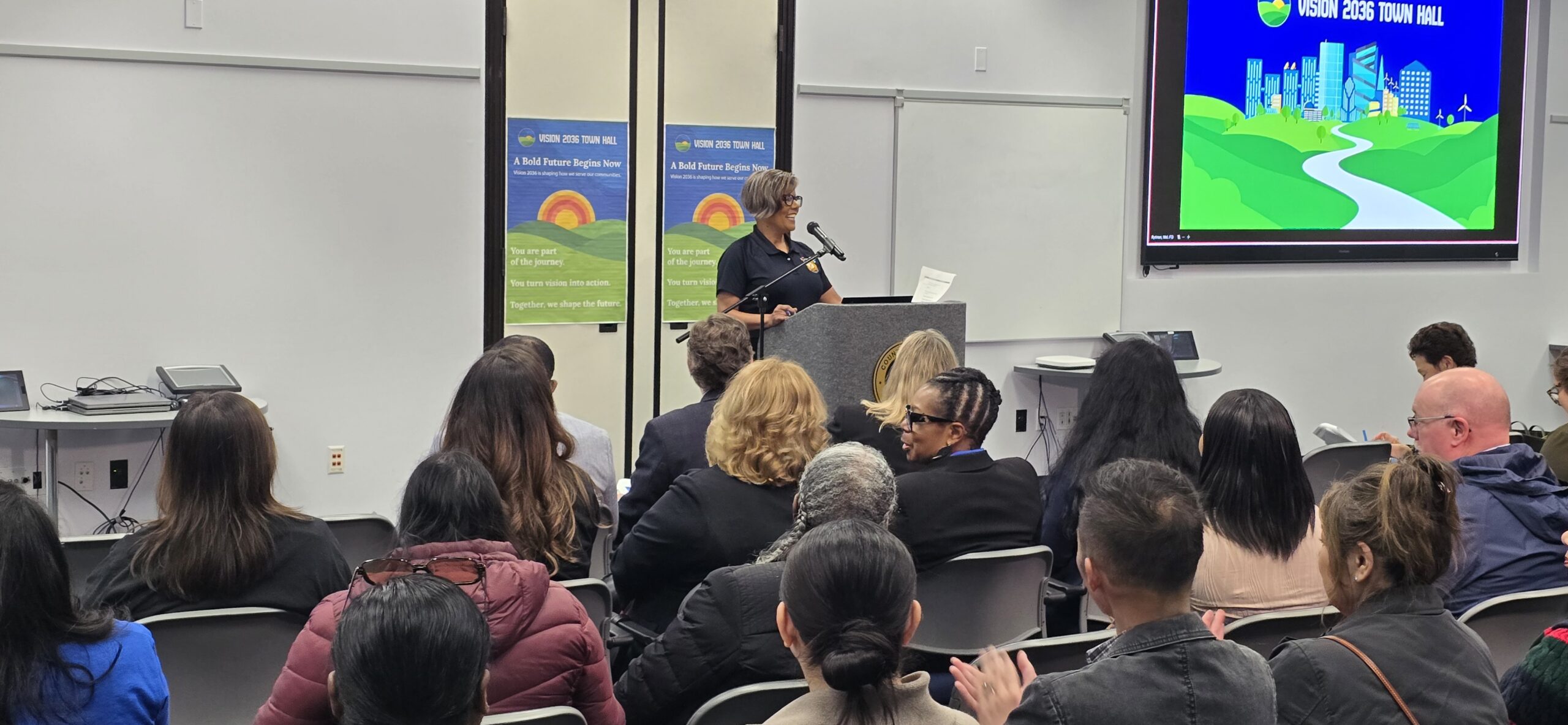 Town Hall hostess Cheryl Hurd speaks to the crowd.